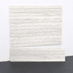Discover the compact elegance of the 4ft Laminated PVC Slatwall in Whitewood by Milwaukee Slatwall, designed for superior durability and sleek aesthetics in smaller garage spaces.