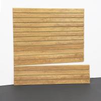 Aspen Maple Slatwall panel with woodgrain finish mounted on garage wall