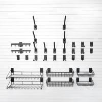 Garage storage solution for snowboard boots and winter jackets with slatwall accessories.