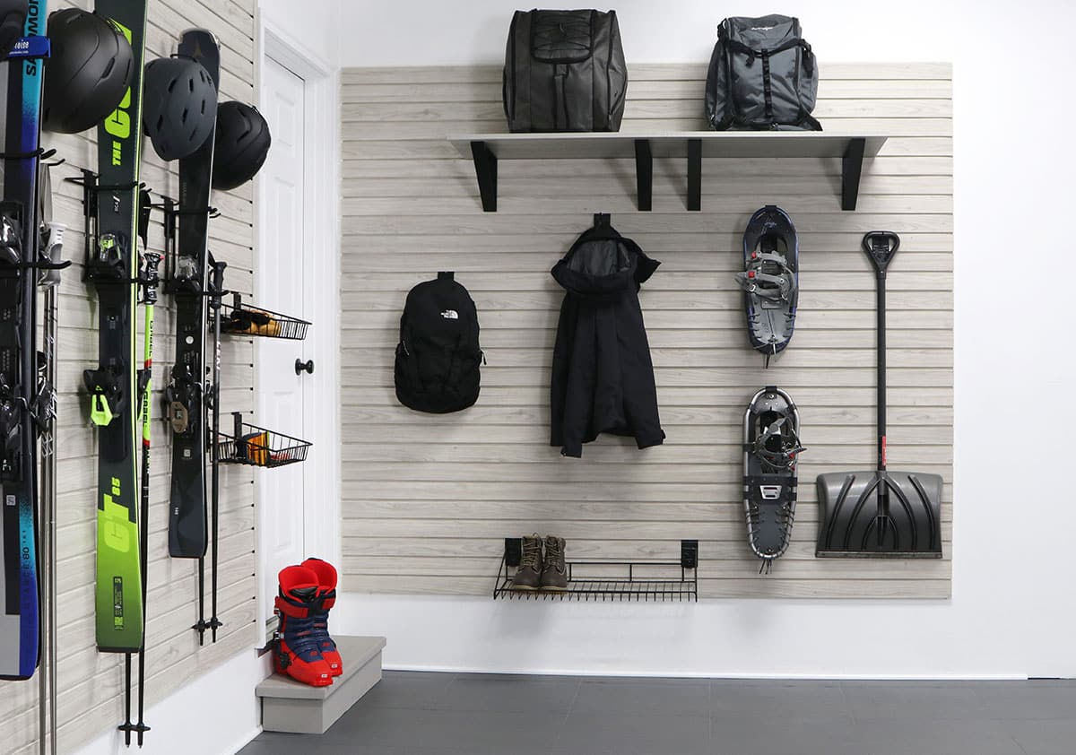 Organized garage with MKE Slatwall panels, hooks, and accessories for winter storage